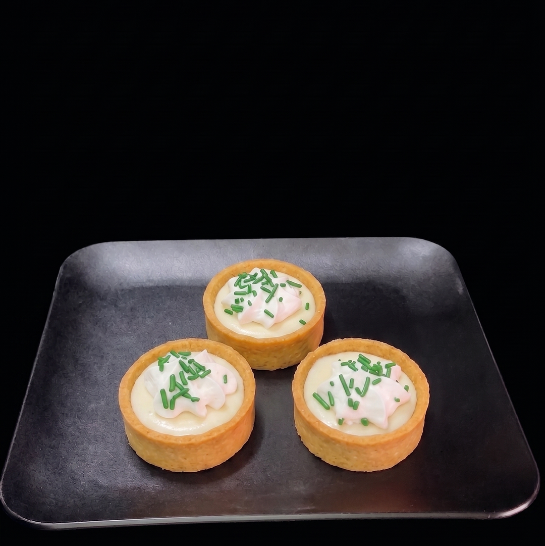 Mini key lime tartlet with smooth citrus custard filling in a buttery pastry shell, handcrafted fresh for dessert tables, weddings, and special events.