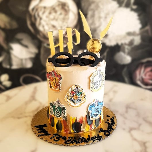 Harry Potter Cake Vegas, Bakery near me, hogwarts school of witchcraft and wizardry cake, magical cake, Gryffindor, Hufflepuff Slytherin and Ravenclaw, which house are you?