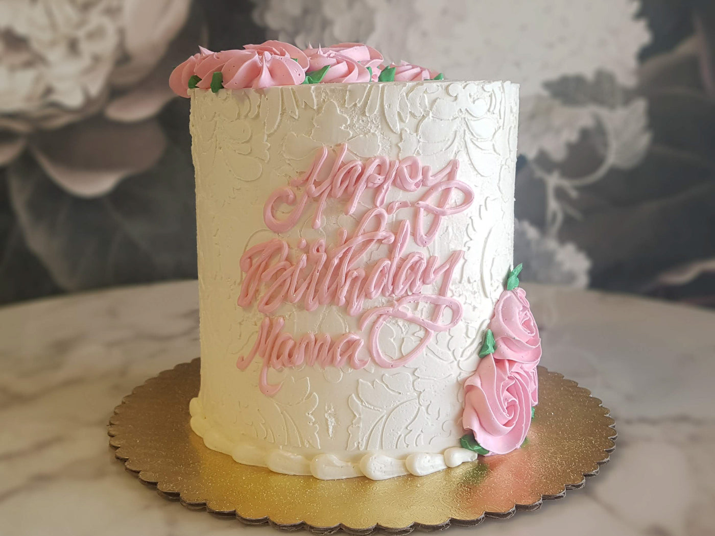    Any proper lady would love to celebrate their special day with our Soft Elegance design. Covered with our classic Italian meringue buttercream, our decorators tediously palette paint every damask pattern on the base cake- HA! Just kidding. It's a damask stencil. We hold our breath and apply the pattern hoping that it makes the perfect imprint on our bas