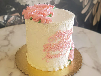    Any proper lady would love to celebrate their special day with our Soft Elegance design. Covered with our classic Italian meringue buttercream, our decorators tediously palette paint every damask pattern on the base cake- HA! Just kidding. It's a damask stencil. We hold our breath and apply the pattern hoping that it makes the perfect imprint on our bas