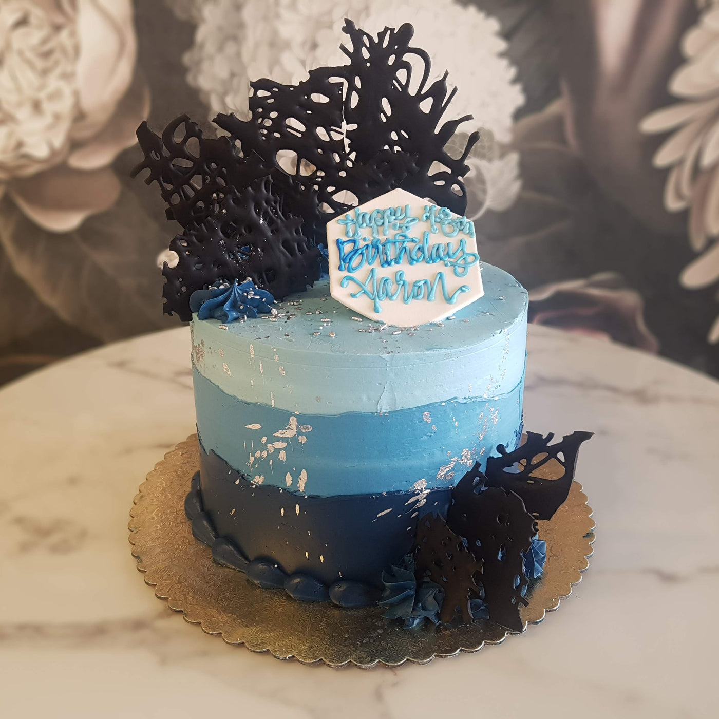 Ombre cakes are here to stay, throw in a couple of silver spatter, sprinkles an chocolate shards and we have ourselves a great men's birthday cake!
