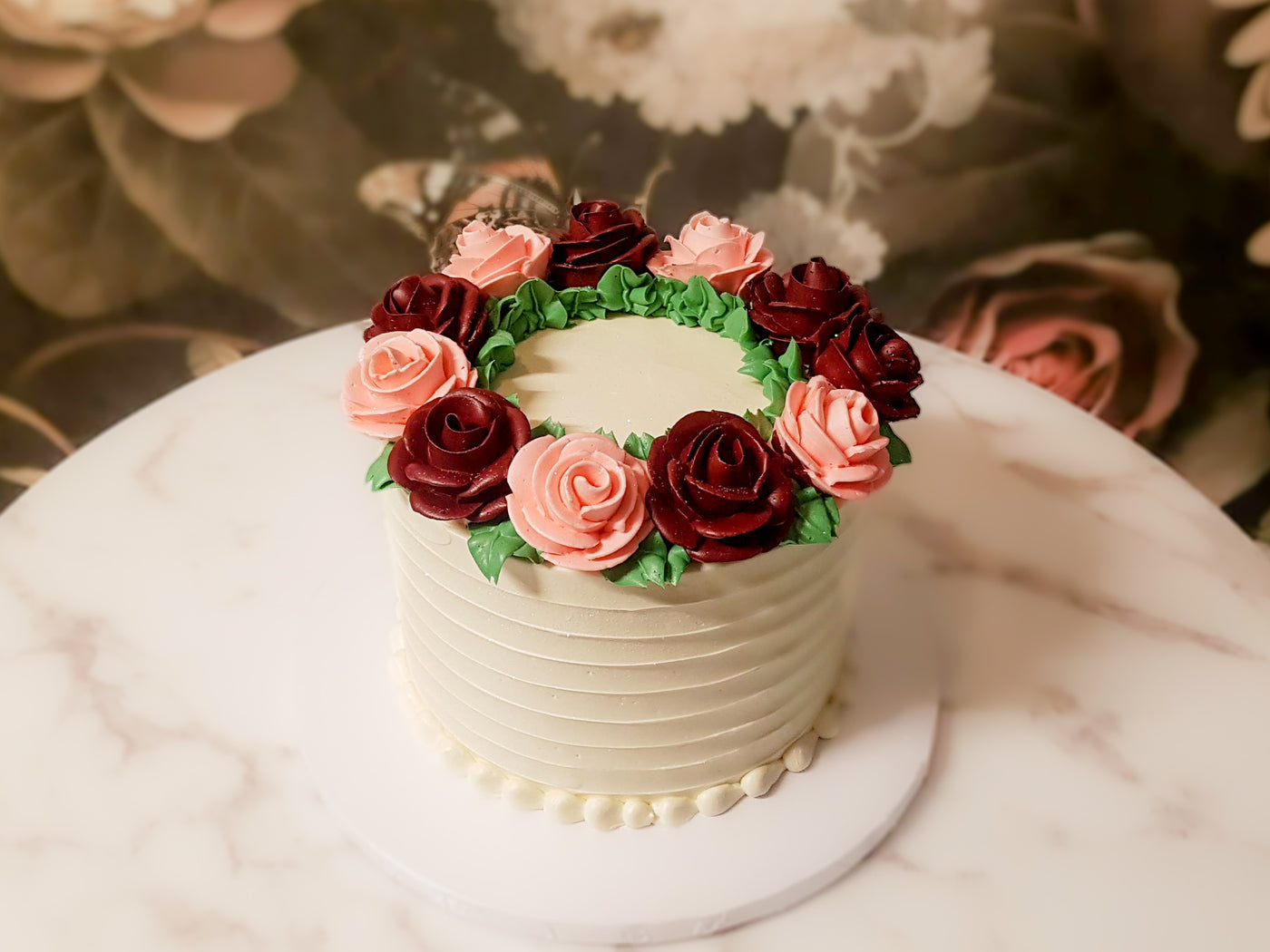 Large roses arranged in a wreath on your cake to create a rustic bohemian vibe- both simple and elegant.  A great centerpiece for your party.  Customize: Flower colors, size, flavor