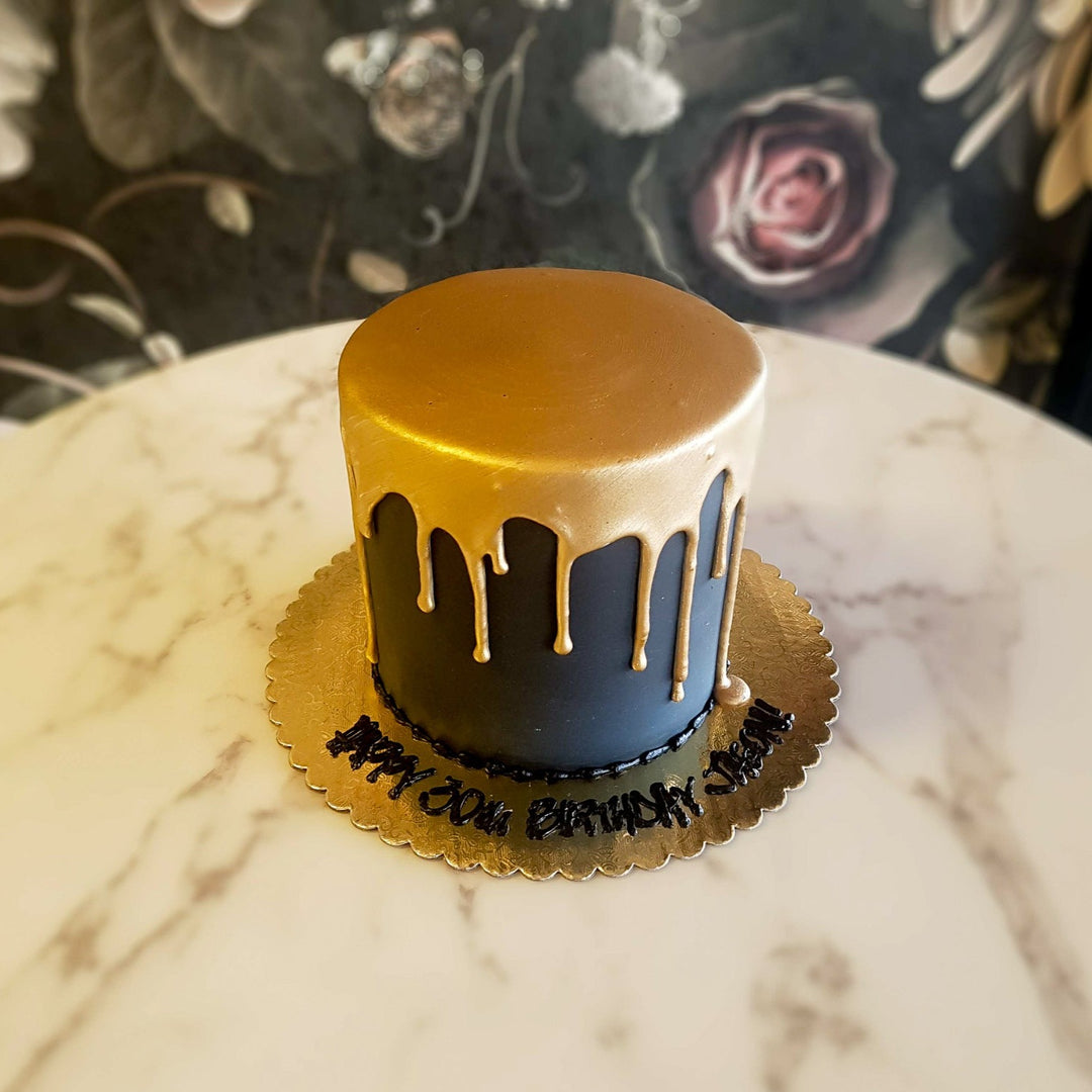 This 24K ganache gold drip cake is covered in back fondant base and creates a simple but classy cake for our celebrants! It is great to design with toppers, liquor or hobby toys at home. men's cake sexy gold cake