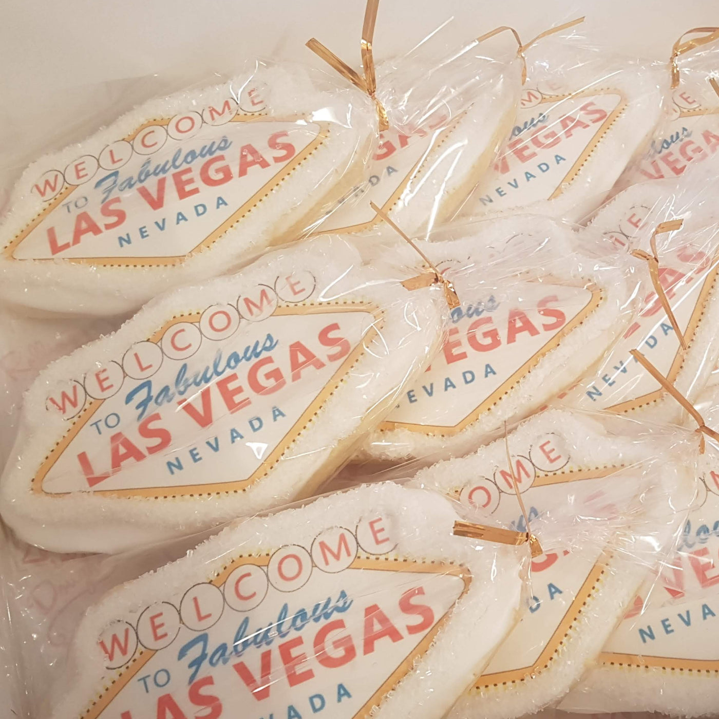 vegas sign sugar cookie, corporate giveaways, planning time, team building, work cookies, themed cookies, custom cookies.