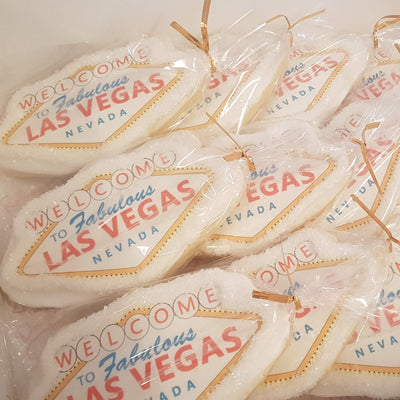 vegas sign sugar cookie, corporate giveaways, planning time, team building, work cookies, themed cookies, custom cookies.