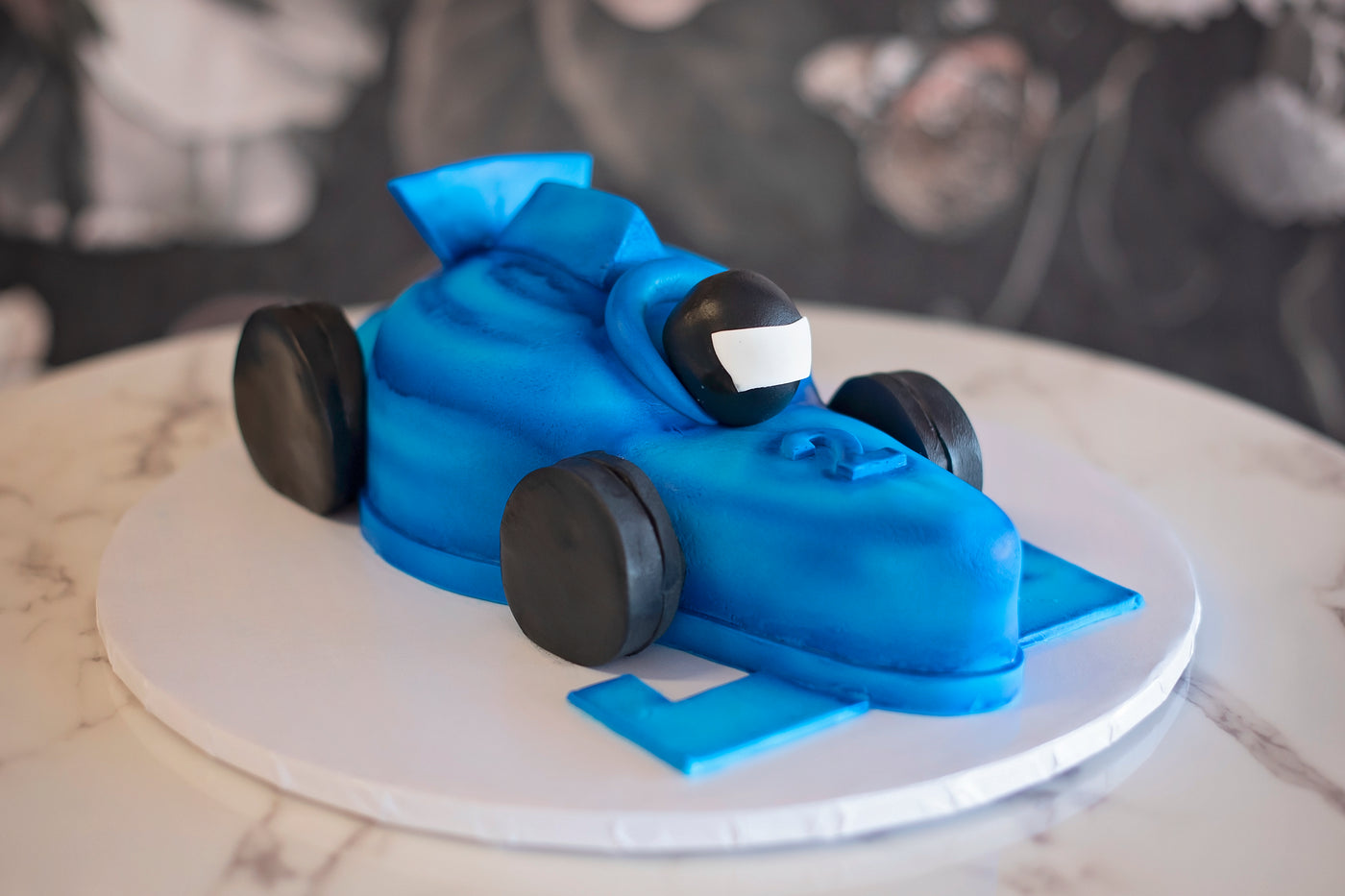 Every kid should have a car themed birthday party! This is the best cake for your kiddo that's growing up "2 fast." Ready your helmets, motor oil and hub caps. This cake is about to rock that Formula 1 party! 