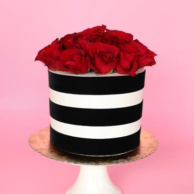 Place that beautiful floral design and sit it perfectly on top of your cake. This season's blooms paired with the most flavorful cake in town is the perfect addition to your  evening. Rose color and kind based on availability.